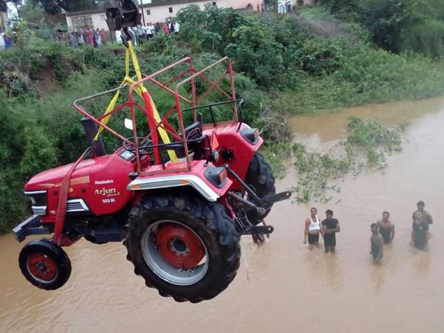 This tractor was trapped in the water for two days at Salwadi village in Junnar Taluka. (HT PHOTO)