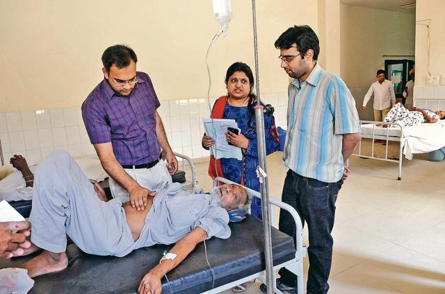 Senior medical officer Dr Anand Singla (left) manages a daily average footfall of 200 at the outpatient department with just one gynaecology specialist (centre) and a fresh medical officer (right) for support at Moonak CHC, one of 100 priority institutions of the Punjab government, in Sangrur. (Gurminder Singh/HT) Senior medical officer Dr Anand Singla (left) manages a daily average footfall of 200 at the outpatient department with just one gynaecology specialist (centre) and a fresh medical officer (right) for support at Moonak CHC, one of 100 priority institutions of the Punjab government, in Sangrur. (Gurminder Singh/HT)