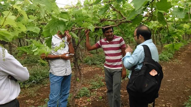 Mathur interacting with farmers as part of his field work. (Handout) Mathur interacting with farmers as part of his field work. (Handout)