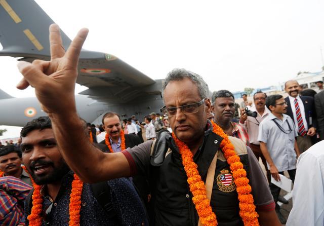 A man, who was evacuated from South Sudan, gestures after disembarking from an Indian Air Force aircraft at Palam airport. (REUTERS) A man, who was evacuated from South Sudan, gestures after disembarking from an Indian Air Force aircraft at Palam airport. (REUTERS)