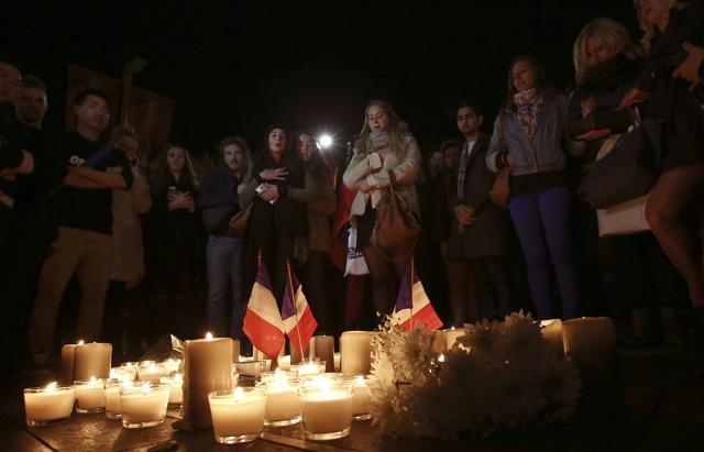 People in Australia’s Sydney stand around a circle of candles during a moment of silence at a vigil to honour victims of the Bastille Day tragedy in Nice, France. (AP) People in Australia’s Sydney stand around a circle of candles during a moment of silence at a vigil to honour victims of the Bastille Day tragedy in Nice, France. (AP)