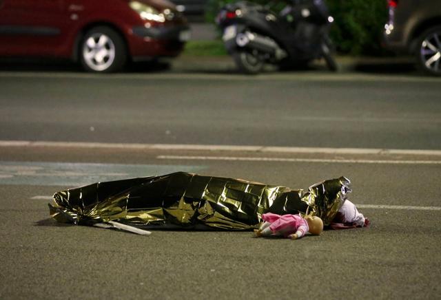 A body is seen on the ground July 15, 2016 after at least 30 people were killed in Nice, France, when a truck ran into a crowd celebrating the Bastille Day national holiday July 14. (REUTERS)