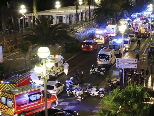 Police officers, firefighters and rescue workers at the site of an attack on the Promenade des Anglais on July 14, after a truck drove into a crowd during a fireworks display in Nice. The attack left 84 dead and scores injured during the celebrations that marked Bastille Day.(AFP Photo)