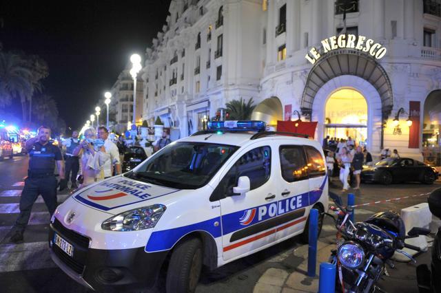A Police car is parked near the scene of the attack in Nice. (AP) A Police car is parked near the scene of the attack in Nice. (AP)