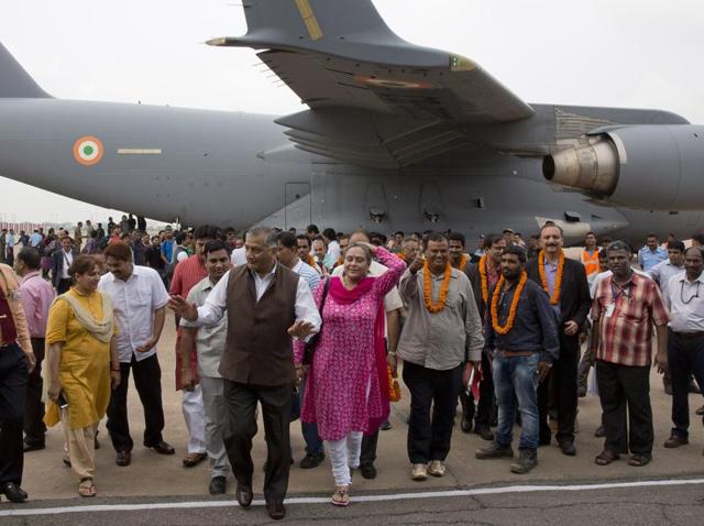 Indian citizens evacuated from war-torn South Sudan arrive at Palam airport in Delhi with junior foreign minister VK Singh. (AP) Indian citizens evacuated from war-torn South Sudan arrive at Palam airport in Delhi with junior foreign minister VK Singh. (AP)