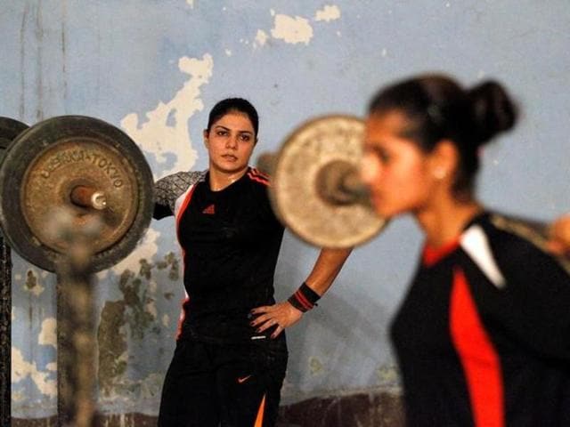 Badminton players train at a sports hall in Lahore, Pakistan July 11, 2016. (REUTERS) Badminton players train at a sports hall in Lahore, Pakistan July 11, 2016. (REUTERS)