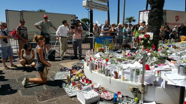 People pay tribute to victims of the terror attack in Nice on Saturday. (HT Photo ) People pay tribute to victims of the terror attack in Nice on Saturday. (HT Photo )