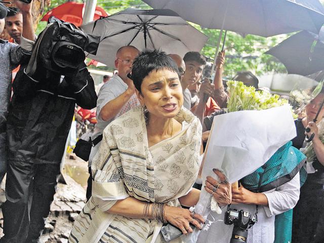 An unidentified woman reacts as she brings flowers to pay respect to the people who died at Holey Artisan Bakery in Dhaka's Gulshan area. (AP File) An unidentified woman reacts as she brings flowers to pay respect to the people who died at Holey Artisan Bakery in Dhaka's Gulshan area. (AP File)