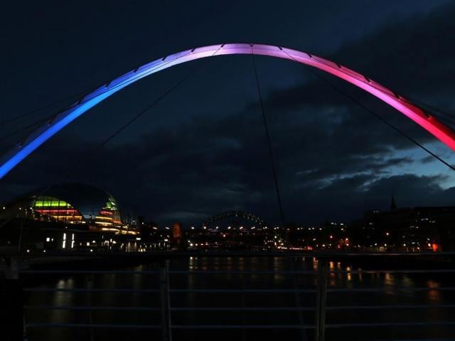 Drenched in blue, white and red: Tributes pour in for Nice victims ...