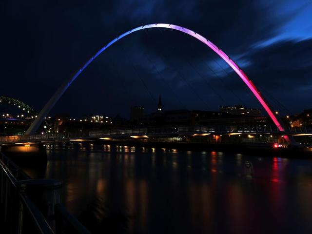 The Gateshead Millennium Bridge is illuminated in blue, white and red lights, in Newcastle, northeast England. (AFP Photo) The Gateshead Millennium Bridge is illuminated in blue, white and red lights, in Newcastle, northeast England. (AFP Photo)