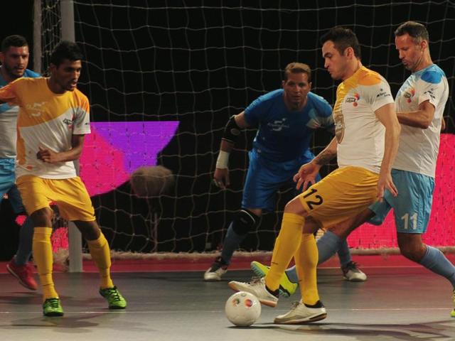 Alessandro Rosa Viera (second right), also known as Falcao, from the Chennai 5's plays against the Mumbai 5's during their Premier Futsal Football League match in Chennai. (AFP Photo) Alessandro Rosa Viera (second right), also known as Falcao, from the Chennai 5's plays against the Mumbai 5's during their Premier Futsal Football League match in Chennai. (AFP Photo)