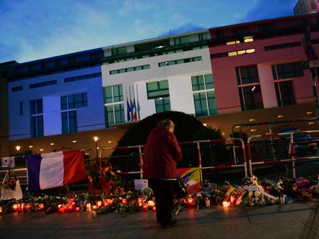 The French embassy is illuminated in the colours of the French tricolor in Berlin as wellwishers left flowers and candles. (AFP Photo) The French embassy is illuminated in the colours of the French tricolor in Berlin as wellwishers left flowers and candles. (AFP Photo)