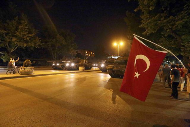 A man raises his hand in front of a military vehicles during an attempted coup in Ankara, Turkey. (REUTERS) A man raises his hand in front of a military vehicles during an attempted coup in Ankara, Turkey. (REUTERS)