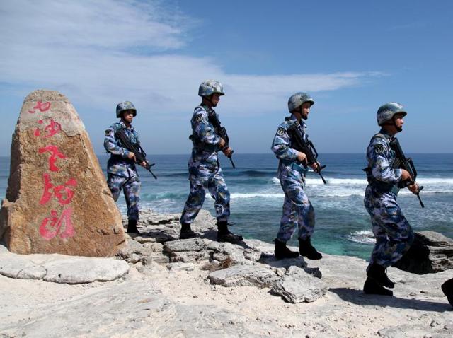 Soldiers of China's People's Liberation Army (PLA) Navy patrol at Woody Island in the Paracel Archipelago, which is known in China as the Xisha Islands, on January 29, 2016. (Reuters file photo) Soldiers of China's People's Liberation Army (PLA) Navy patrol at Woody Island in the Paracel Archipelago, which is known in China as the Xisha Islands, on January 29, 2016. (Reuters file photo)