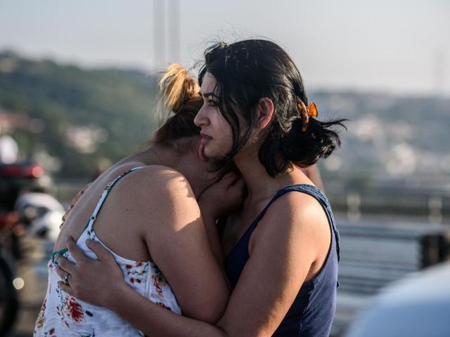 Women react after people took over military position on the Bosphorus bridge in Istanbul. (AFP-Representational) Women react after people took over military position on the Bosphorus bridge in Istanbul. (AFP-Representational)