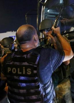 Turkish soldiers surrender their weapons to policemen during an attempted coup in Istanbul's Taksim Square, Turkey. (Reuters)