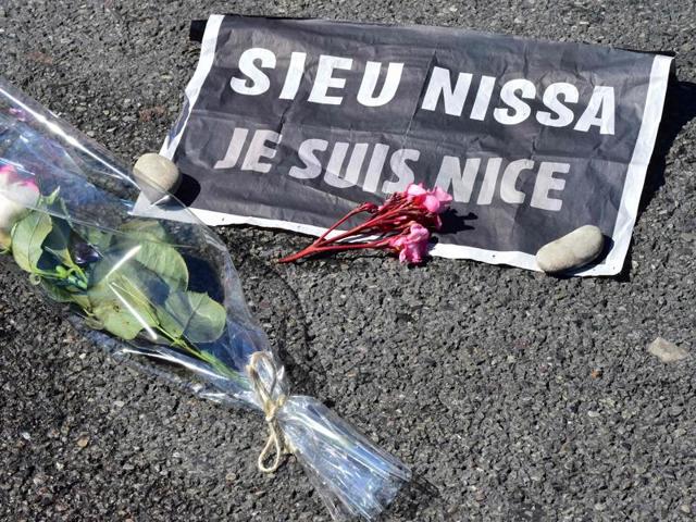This picture taken on July 16, 2016 shows a rose and a sign reading "Je suis Nice" (I am Nice) placed near a stain on the pavement on la Promenade des Anglais in tribute to the victims of the deadly Bastille Day attack in Nice. (AFP) This picture taken on July 16, 2016 shows a rose and a sign reading "Je suis Nice" (I am Nice) placed near a stain on the pavement on la Promenade des Anglais in tribute to the victims of the deadly Bastille Day attack in Nice. (AFP)