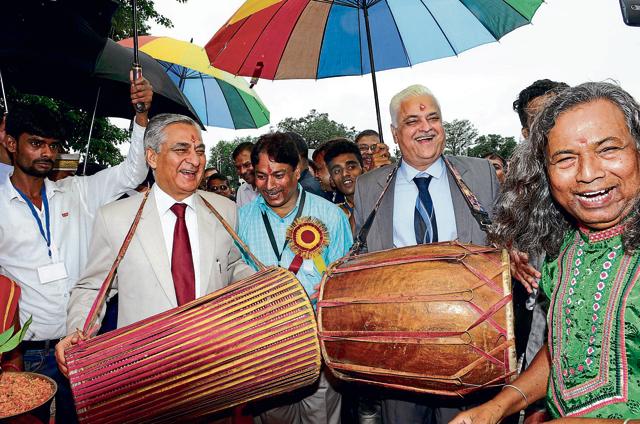 Chief Justice of India TS Thakur (left) and Supreme Court justice AR Dave try their hands on tribal folk drums in Ranchi on Saturday. Thankur was in the city to attend a seminar on continuing legal education for lawyers and its benefits”, organised by the Jharkhand State Bar Council. (Diwakar Prasad / Hindustan Times) Chief Justice of India TS Thakur (left) and Supreme Court justice AR Dave try their hands on tribal folk drums in Ranchi on Saturday. Thankur was in the city to attend a seminar on continuing legal education for lawyers and its benefits”, organised by the Jharkhand State Bar Council. (Diwakar Prasad / Hindustan Times)