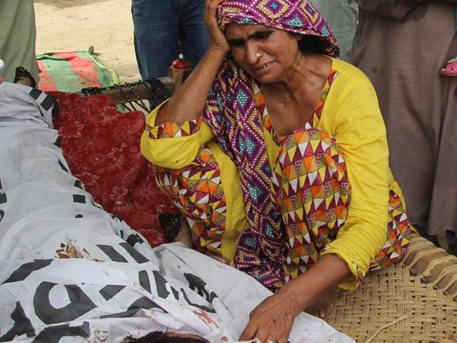Mother of social media celebrity Qandeel Baloch mourns alongside her body during her funeral in Shah Sadar Din village, around 130km from Multan in Pakistan. (AFP photo) Mother of social media celebrity Qandeel Baloch mourns alongside her body during her funeral in Shah Sadar Din village, around 130km from Multan in Pakistan. (AFP photo)