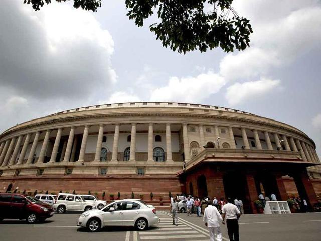 Traffic flows in front of Parliament House before the start of monsoon session in New Delhi.(HT Photo)