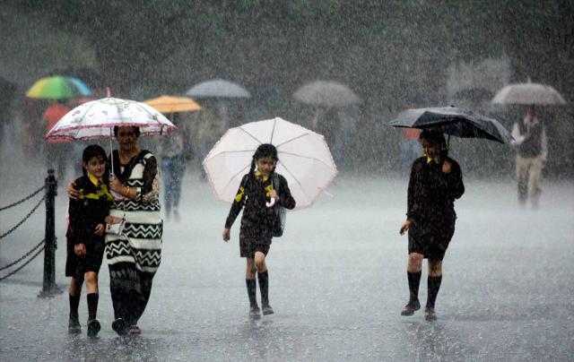 People walking with the umbrella during heavy rain in Shimla on Saturday. (PTI Photo) People walking with the umbrella during heavy rain in Shimla on Saturday. (PTI Photo)