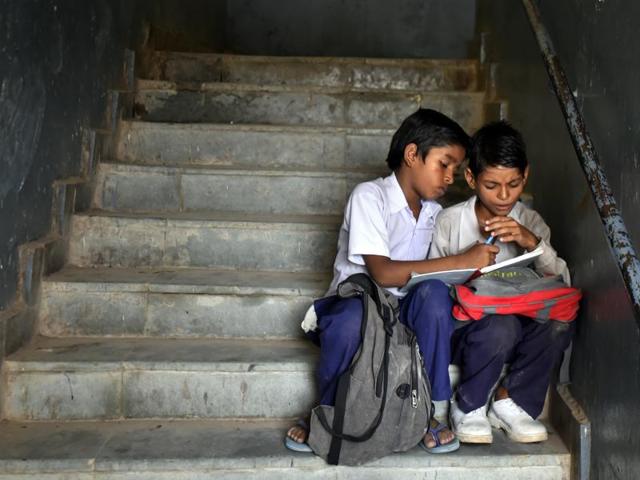 Teachers know the problem. They can’t do much to improve the condition. “I make them take turns to sit on the desk and chairs. Half of my time gets wasted on it and then teaching in such classrooms is impossible as there is so much noise,” said a teacher. (Ravi Choudhary/ HT Photo)