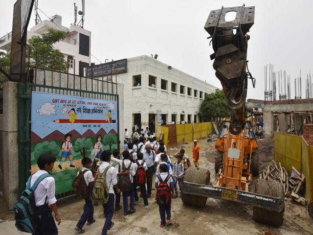 The gates of the school open to an under construction building, with filth all around and the smell of urine all pervasive. (Ravi Choudhary/ HT Photo)