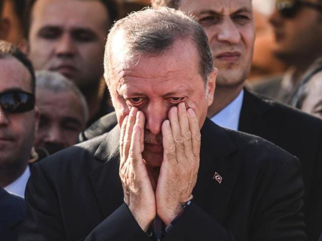 Turkey's President Recep Tayyip Erdogan reacts after attending the funeral of a victim of the coup attempt in Istanbul. (AFP) Turkey's President Recep Tayyip Erdogan reacts after attending the funeral of a victim of the coup attempt in Istanbul. (AFP)