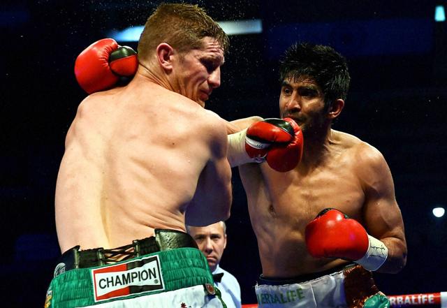 Vijender Singh hits his opponent Australia's Kerry Hope during the WBO Asia Pacific Super Middleweight Championship. (PTI Photo) Vijender Singh hits his opponent Australia's Kerry Hope during the WBO Asia Pacific Super Middleweight Championship. (PTI Photo)