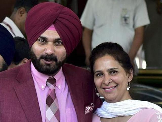 Cricketer-turned-politician Navjot Singh Sidhu with his wife Navjot Kaur Sidhu outside Parliament in New Delhi.(HT File Photo)