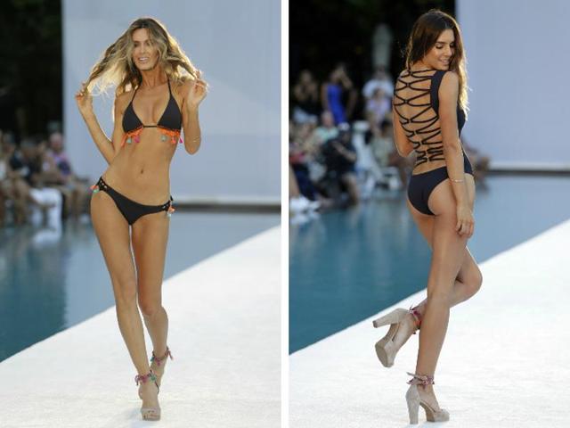 Black bikinis are forever a favourite. However, the designers did play a bit with some tassels and criss-cross string work. (AP Photos) Black bikinis are forever a favourite. However, the designers did play a bit with some tassels and criss-cross string work. (AP Photos)