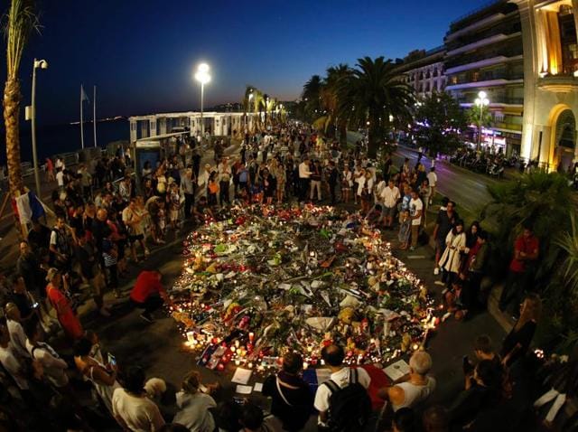 A child stands near flowers and burning candles placed to pay tribute to victims of the truck attack along the Promenade des Anglais on Bastille Day in Nice, France. (Reuters Photo) A child stands near flowers and burning candles placed to pay tribute to victims of the truck attack along the Promenade des Anglais on Bastille Day in Nice, France. (Reuters Photo)