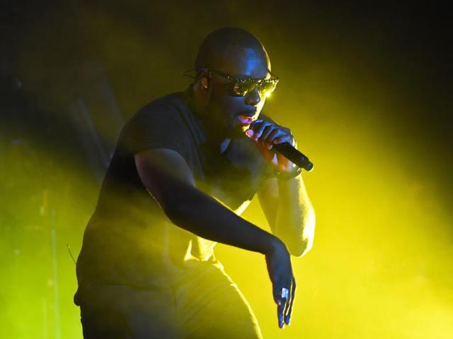 French singer Maitre Gims showing his signature moves. during his performance. (AFP) French singer Maitre Gims showing his signature moves. during his performance. (AFP)