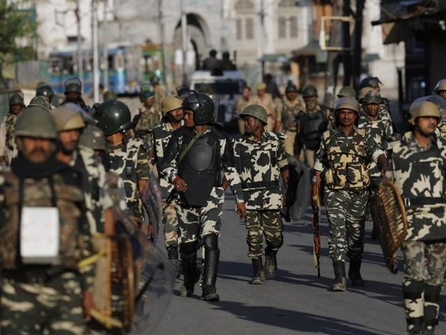 Paramilitary soldiers walk towards their base camp on the 10th straight day of curfew in Srinagar. (AP) Paramilitary soldiers walk towards their base camp on the 10th straight day of curfew in Srinagar. (AP)