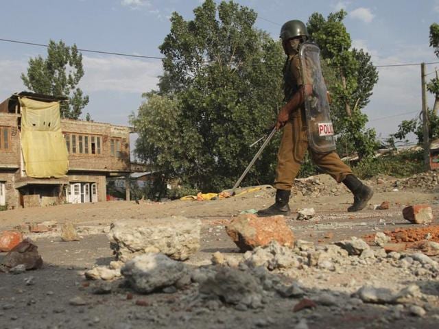 A soldier walks towards their base camp on the ninth straight day of curfew in Srinagar. (AP) A soldier walks towards their base camp on the ninth straight day of curfew in Srinagar. (AP)