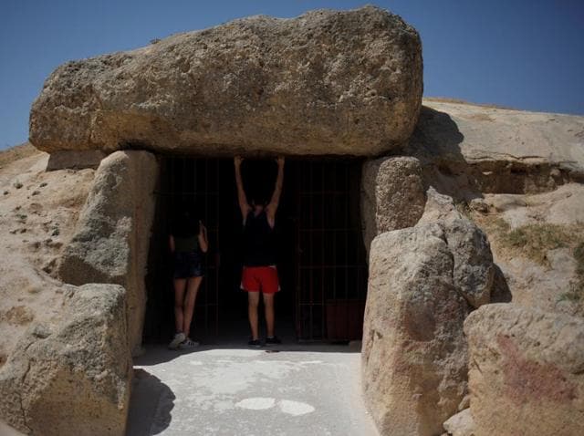 People enter the Menga dolmen. (REUTERS)