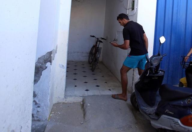 Jabeur Lahouaiej Bouhlel, the brother of Mohamed Lahouaiej Bouhlel, the man who drove a heavy truck into crowds in the French city of Nice killing at least 84 people on Friday, holds his phone near his house in Msaken, Tunisia, July 15, 2016. REUTERS/Zoubeir Souissi Jabeur Lahouaiej Bouhlel, the brother of Mohamed Lahouaiej Bouhlel, the man who drove a heavy truck into crowds in the French city of Nice killing at least 84 people on Friday, holds his phone near his house in Msaken, Tunisia, July 15, 2016. REUTERS/Zoubeir Souissi