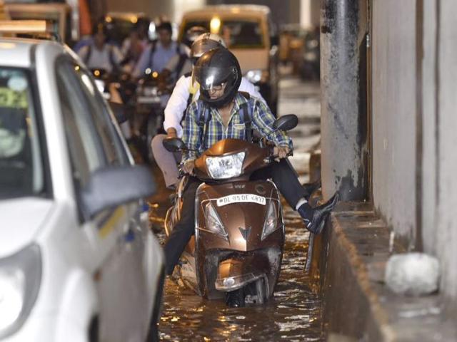 The weather department reported 23.8 mm of rain between Sunday night and Monday morning. In this photo, vehicles can be seen stuck at Sarita Vihar underpass. (Saumya Khandelwal/HT Photo) The weather department reported 23.8 mm of rain between Sunday night and Monday morning. In this photo, vehicles can be seen stuck at Sarita Vihar underpass. (Saumya Khandelwal/HT Photo)