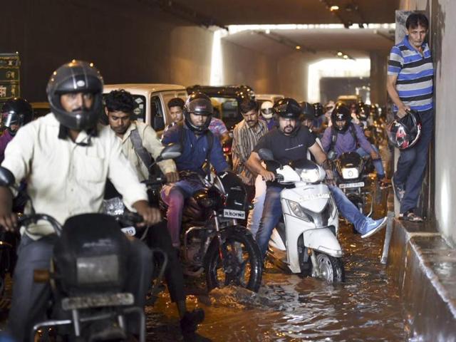 Commuters navigate through a water logged underpass at Sarita Vihar after rains in New Delhi on Monday, July 18, 2016. (Saumya Khandelwal/HT Photo) Commuters navigate through a water logged underpass at Sarita Vihar after rains in New Delhi on Monday, July 18, 2016. (Saumya Khandelwal/HT Photo)