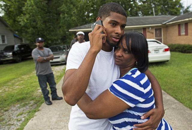 Beverly Blakes, the aunt of fallen Baton Rouge policeman Montrell Jackson, hugs Kedrick Pitts, the half-brother of slain Baton Rouge policeman. (AP Photo) Beverly Blakes, the aunt of fallen Baton Rouge policeman Montrell Jackson, hugs Kedrick Pitts, the half-brother of slain Baton Rouge policeman. (AP Photo)