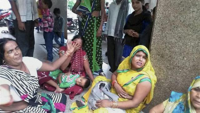 Disconsolate relatives wail after several people died due to consumption of spurious liquor in Farukhabad on Sunday. (PTI Photo) Disconsolate relatives wail after several people died due to consumption of spurious liquor in Farukhabad on Sunday. (PTI Photo)