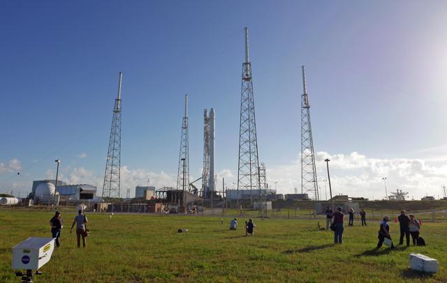 Photographers set up remote cameras preparing to cover the Falcon 9 SpaceX rocket launch at complex 40 at the Cape Canaveral Air Force Station. (AP Photo) Photographers set up remote cameras preparing to cover the Falcon 9 SpaceX rocket launch at complex 40 at the Cape Canaveral Air Force Station. (AP Photo)