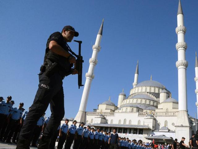 An armed Turkish police officer stands guard during a funeral ceremony for victims of the failed July 15 coup attempt at Kocatepe Mosque in Ankara. (AFP) An armed Turkish police officer stands guard during a funeral ceremony for victims of the failed July 15 coup attempt at Kocatepe Mosque in Ankara. (AFP)