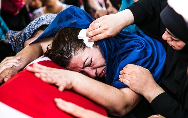 A woman lays her head on the coffin of a victim of the failed July 15 coup attempt during his funeral in Istanbul. (AFP) A woman lays her head on the coffin of a victim of the failed July 15 coup attempt during his funeral in Istanbul. (AFP)