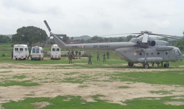 A IAF chopper waits to airlift bodies of CRPF men. (HT Photo) A IAF chopper waits to airlift bodies of CRPF men. (HT Photo)