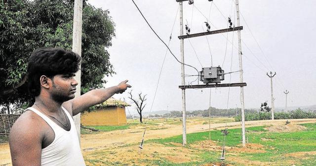 A villager shows a transformer that was installed ten days ago. (Bijay/HT Photo) A villager shows a transformer that was installed ten days ago. (Bijay/HT Photo)
