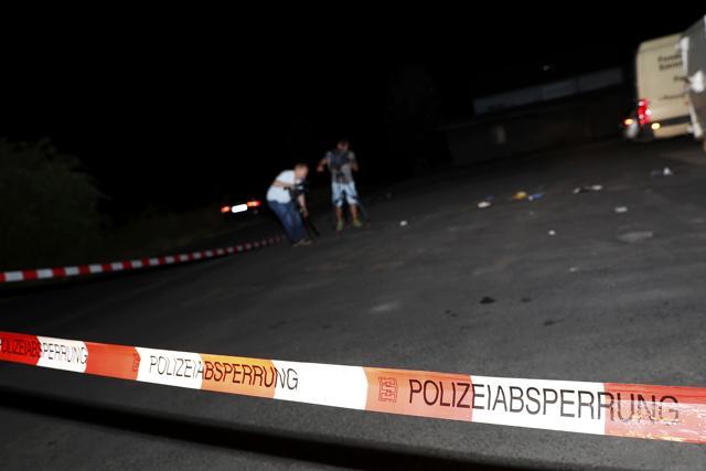 Cameramen film at the scene where a man was shot dead by the police after attacking passengers on a train with an axe near the city of Wuerzburg. (REUTERS) Cameramen film at the scene where a man was shot dead by the police after attacking passengers on a train with an axe near the city of Wuerzburg. (REUTERS)