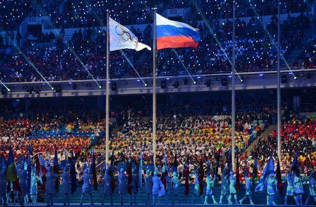 A file photo of an Olympic Games flag and a Russian flag waving during the closing ceremony of the winter Olympics in Sochi. (AFP Photo) A file photo of an Olympic Games flag and a Russian flag waving during the closing ceremony of the winter Olympics in Sochi. (AFP Photo)