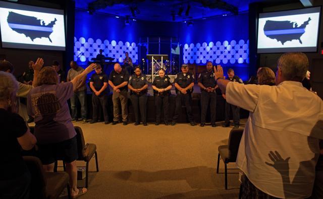Members of The Rock Church, located on the outskirts of Baton Rouge, hold a prayer vigil for the officers killed and wounded by a gunman. (AP Photo) Members of The Rock Church, located on the outskirts of Baton Rouge, hold a prayer vigil for the officers killed and wounded by a gunman. (AP Photo)