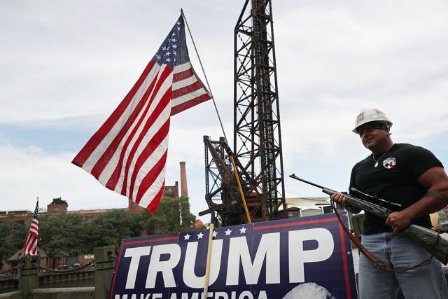 A Donald Trump supporter poses with a gun while attending a rally for Donald Trump on the first day of the Republican National Convention (RNC) in downtown Cleveland, Ohio on Monday. (AFP) A Donald Trump supporter poses with a gun while attending a rally for Donald Trump on the first day of the Republican National Convention (RNC) in downtown Cleveland, Ohio on Monday. (AFP)